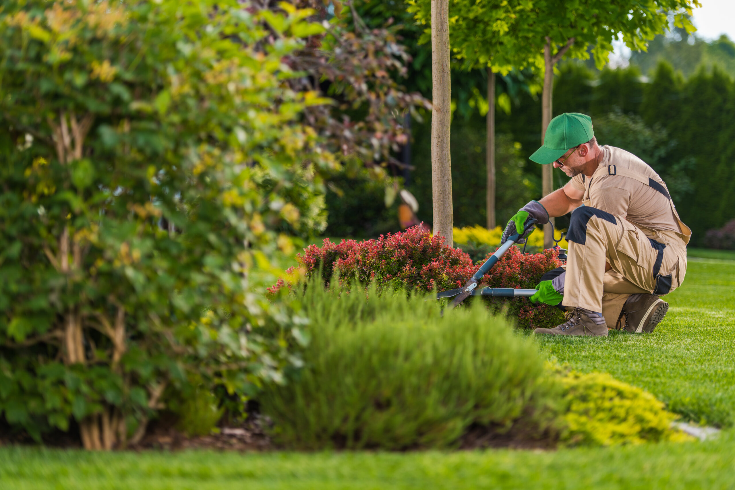 Staff Gardener works in garden at The Village at Brookwood independent living facility in Burlington, NC